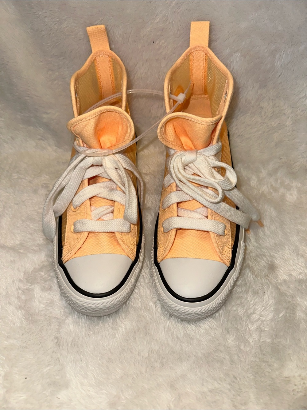 Converse Peach High Top Canvas and Mesh Sneakers with White Toe Cap.